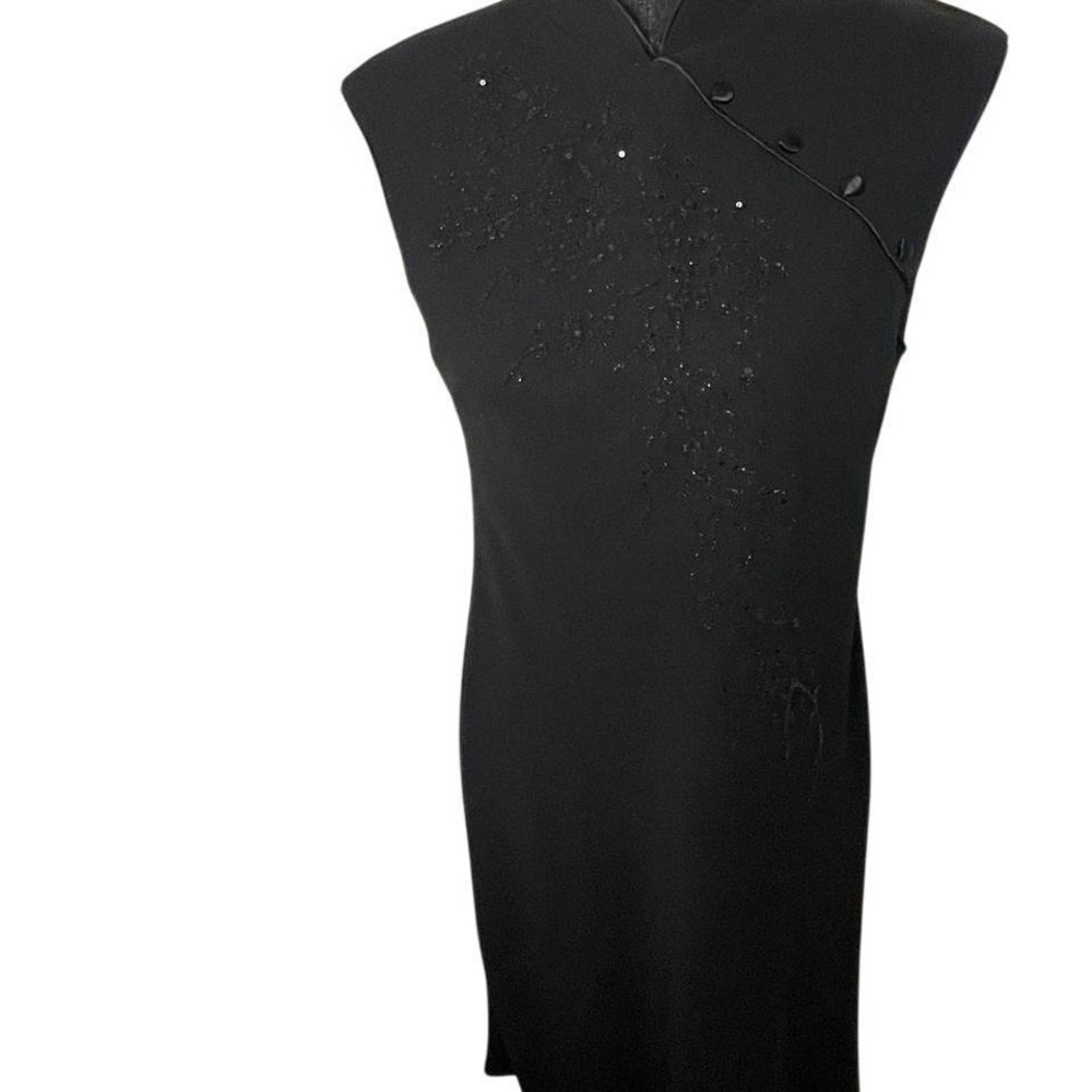 Black beaded dress detailed bead design and high neck collar. Size 10.
